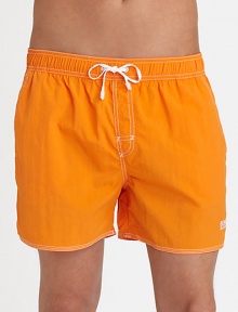 With stitched details and a grip-tape back patch pocket, these stylish swim trunks are both sporty and functional.Elastic drawstring waistStich detail at flySlash side pocketsBack grip-tape patch pocketInseam, about 4½PolyamideMachine washImported