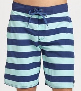 Stay stylish in the sun, the sand and beyond in these striped board shorts shaped in lightweight, breathable cotton.Drawstring tie waistSide welt pocketInseam, about 8NylonMachine washImported