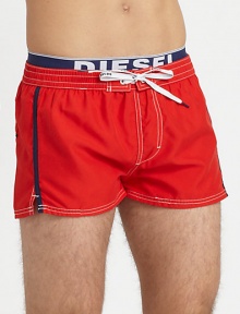 A summer beach essential for the contemporary man, shaped in quick-drying nylon and finished with an elastic logo waistband.Elastic drawstring-tie waistRear patch pocketInseam, about 2PolyesterMachine washImported