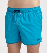 Stylish swim trunks are both sporty and functional, rendered in quick-drying nylon.Elastic drawstring waistSide slash, back flap pocketsInseam, about 4PolyamideMachine washImported