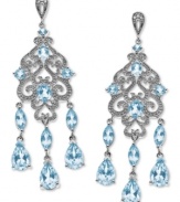 Truly spectacular sparkle. Light up the night with these luminous chandelier earrings in marquise, oval and round-cut blue topaz (8-1/4 ct. t.w.) with sparkling diamond accents. Set in sterling silver. Approximate drop: 2-1/8 inches.