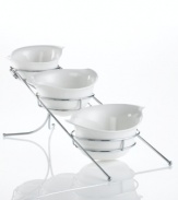 These Natura bowls from Godinger's collection of serveware and serving dishes combine elegant white porcelain with chrome racks, ensuring your table is beautiful but protected. Handles make things easier for the host.