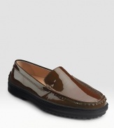 Shiny patent leather design is part loafer, part driver, pure comfort on a nubby rubber sole. Rubber heel, ½ (15mm) Moccasin-stitched front Rubber nub detail at heel Leather lining Rubber sole Made in ItalyOUR FIT MODEL RECOMMENDS ordering true size.. 