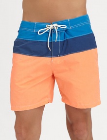 A summer essential for the beach, poolside and beyond set in colorblocked nylon for a crisp, contemporary finish.Drawstring waistSide slash, back welt pocketInseam, about 565% cotton/35% nylonMachine washImported