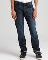 Slim fit jeans in a distressed dark wash for denim with a rugged attitude by J Brand.