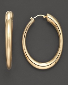 Oval hoop earrings in 14K yellow gold.