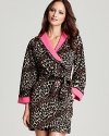 A leopard print hooded robe with a hot pink lining, shawl collar and cuffs, perfect for the wild at heart.