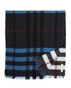 This Burberry plaid scarf is reversible for maximum versatile style. Rich medium blue and black adorn the front, and the reverse features a faded red, blue and black that hints at vintage cool.