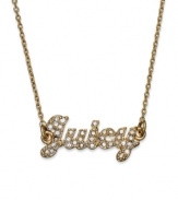 The write stuff. Juicy Couture plays the name game in winning fashion with this necklace crafted from gold tone brass with glass accents and cubic zirconia (1/2 ct. t.w.). Approximate length: 14 inches + 3-inch extender. Approximate drop: 3/8 inch.