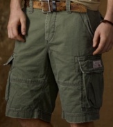 Crafted from faded and frayed cotton chino twill, a classic cargo short looks right at home in the urban jungle with its rugged safari style and utility details.