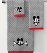 See you real soon! The ever-lovable Mickey Mouse steals the show in this hand towel from Disney, featuring a jacquard woven polka dot backdrop with an embroidered Mickey face. Finished with red trim.