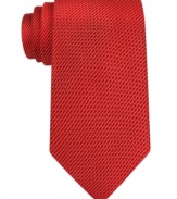 Pinstripes put a new spin on the business basic with this handsome Sean John silk tie.