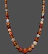 Spruce up your look with a splash of citrus! This vivid necklace features graduated, orange onyx beads (6-16 mm) and a 14k gold clasp. Approximate length: 18 inches.