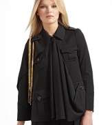 An avante-garde silhouette impeccably tailored in fine Italian wool, fuses the drama of a cape and the warmth of a jacket.Asymmetrical point collar Epaulettes with dangling goldtone chains Left cape sleeve Right long sleeve Sleeves have four button cuffs Front button closure Center front drape Front button flap pockets Back flap shoulder yoke Back vented hemAbout 24 from shoulder to hem Fully lined Wool; dry clean Made in Italy