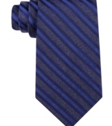 Standout stripes amp up any night out with this sharp silk tie from Calvin Klein.