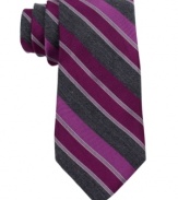 Be bold-start the day with confidence in this striped silk tie from Calvin Klein.