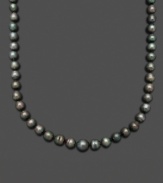 Channel the look of a Tahitian goddess. Belle de Mer's smooth strand of black cultured Tahitian pearls (8-9 mm) completes a look of rich opulence. Set in 14k gold. Approximate length: 18 inches.