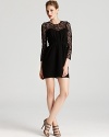 Shoshanna dresses up the LBD in delicate lace, showcasing sheer sleeves and a bustier-inspired lining.