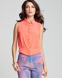 Break out of the tee zone and opt for this silk Nanette Lepore top, designed with buttons through the front and flaunting a luscious summer hue. Imbuing your look with flavorful style, the silhouette teams with colorful prints for a punchy, trend-right finish.