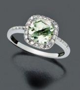 Indulge in gorgeous, green luxury. Cushion-cut green quartz (1-1/4 ct. t.w) takes on the sparkle of saltwater alongside round-cut diamond accents (1/10 ct. t.w.). Victoria Townsend ring crafted in sterling silver. Size 7.