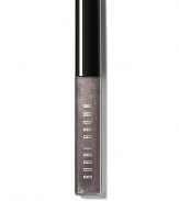 Infused with just a hint of pearly shimmer, this gives lips a subtle, glimmering look. Inspired by the play of pretty shades with an edgy twist, this gloss is part of Bobbi's Caviar & Oyster Collection and adds non-sticky shine to bare lips or your favorite lipstick. Formulated with aloe extract to soothe and soften lips; Vitamins C and E for anti-oxidant protection; and jojoba and avocado oils to moisturize lips. Made in USA. 