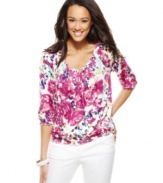 Fresh florals and sparkling sequins adorn this easy peasant top, from Charter Club.