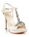 Softly shimmering satin t-straps go glam with the addition of bold, faceted rhinestones. By IVANKA TRUMP.