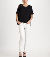 Cutout shoulders and a cropped back hem add edge to this sophisticated silk crewneck. CrewneckCutout shouldersThree-quarter flutter sleevesCropped back hemSilkDry cleanImportedModel shown is 5'10 (177cm) wearing US size Small.