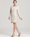 True elegance is realized with this KAS New York crochet lace dress, cut in a slim silhouette with long sheer sleeves. A visible nude lining adds to its allure; complement the neutral tone with coordinating pumps.