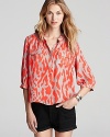 A fiery print alights upon this breezy silk blouse from Parker--perfect with your office basics or off-duty denim.