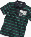 Prepster style meets denim heritage in this vintage-themed polo from GUESS: Front logo patches features the number 19 while back logo reads 81 to proclaim the year of the company's founding.