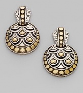 From the Naga Collection. A stunning design, these disc-shaped drop earrings combine dots and arcs, sterling silver and 18k gold, in a collection that feels both tribal and modern.18k yellow gold and sterling silver Drop, about 1 Post back Made in Bali