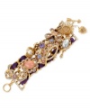 The royal treatment. This multi-charm bracelet from Betsey Johnson is crafted from gold-tone mixed metal and a purple grosgrain ribbon. Crystal accents add luster to the various charms, one of which is a crown at the center. Approximate length: 7-1/2 inches.