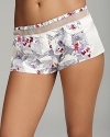 Elegant floral print sleepshorts with contrast side panels and sheer mesh details at waist.