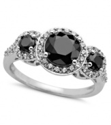 Precision style with a hint of sparkle. Arabella's stunning three-stone ring combines round-cut black (2-7/8 ct. t.w.) and white (3/4 ct. t.w.) Swarovski zirconias in a pretty circular pattern. Set in sterling silver. Size 7.