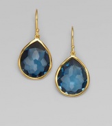 A deeply hued, richly faceted teardrop of London blue topaz shimmers within a delicate setting of 18k gold. London blue topaz 18k yellow gold Drop, about 1¼ Ear wire Imported