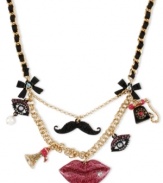 Face value. Betsey Johnson features features in this gold-tone mixed-metal frontal necklace. Glittery glass accents will make everyone want to see your face. Approximate length: 16 inches + 3-inch extender. Approximate drop: 2-1/4 inches.