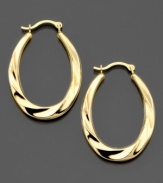 These 14k gold hoop earrings feature a sultry swirl pattern with a slightly elongated shape. Approximate drop: 1 inch. Approximate diameter: 1/2 inch.