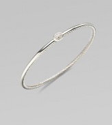 A slender bangle of twisted sterling silver cable is topped by a delicate oval of pavé diamonds. Diamonds, 0.07 tcw Sterling silver Diameter, about 2¼ Imported