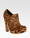 A fierce tiger-print transforms this tall platform shape of lush calf hair. Self-covered heel, 5½ (140mm)Covered platform, 1 (25mm)Compares to a 4½ heel (115mm)Calf hair upperSide zipLeather lining and solePadded insoleMade in Italy