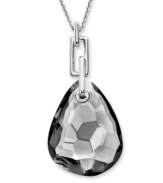 Neutral territory. Swarovski's gorgeous gray-hued crystal pendant necklace is versatile enough to complement a variety of looks in your wardrobe. Featuring a gemstone-cut satin crystal on a chain link necklace, it's set in silver tone mixed metal. Approximate length: 35-7/16 inches. Approximate drop: 2-3/8 inches.