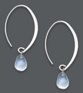 Subtly stunning. Polished hoop earrings receive an added hint of color with a shimmering aquamarine drop (3 ct. t.w.). Open hoop setting crafted in sterling silver. Approximate drop: 1-1/2 inches.