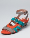 Rich hues in soft suede make a charming trio on these colorblocked Rebecca Minkoff sandals, finished with gleaming buckles and a subtle wedge heel.