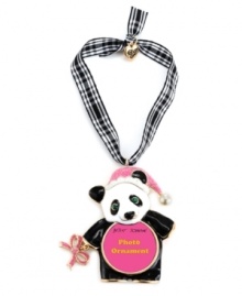 What's black and white and cute all over? Betsey Johnson's panda picture frame ornament! Made in gold tone mixed metal, it features a pink glitter bow accent and Santa hat as well as crystal accents. Hangs from a gingham ribbon. Approximate length: 2-3/4 inches. Approximate drop: 4-1/4 inches.