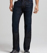 Joe's Jeans relaxed fit jeans in a dark wash features straight legs, a normal rise, worn detailing and contrast stitching. Joe's signature stitching on back pockets.