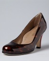 Red heels pop in this distinctive Anyi Lu design, perfect to jazz up your work-a-day neutrals.