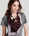 SONIA RYKIEL's script signature is emblazoned across the middle of this striped scarf from the French designer.