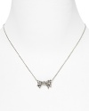 A pavé crystal bow lends a touch of classic elegance to your look. By Juicy Couture.