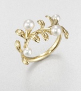 A floral piece in 18k gold and lustrous cultured pearls. 3.75mm-4.75mm round white cultured pearls18k goldImported 