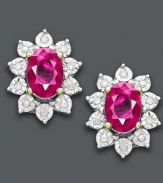 Add a pop of color. These regal and rich-looking stud earrings highlight oval-cut rubies (1-1/3 ct. t.w.) encircled by round-cut diamonds (5/8 ct. t.w.). Crafted in 10k gold. Approximate diameter: 3/8 inch.